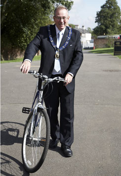 local Mayor wheeling pushbike